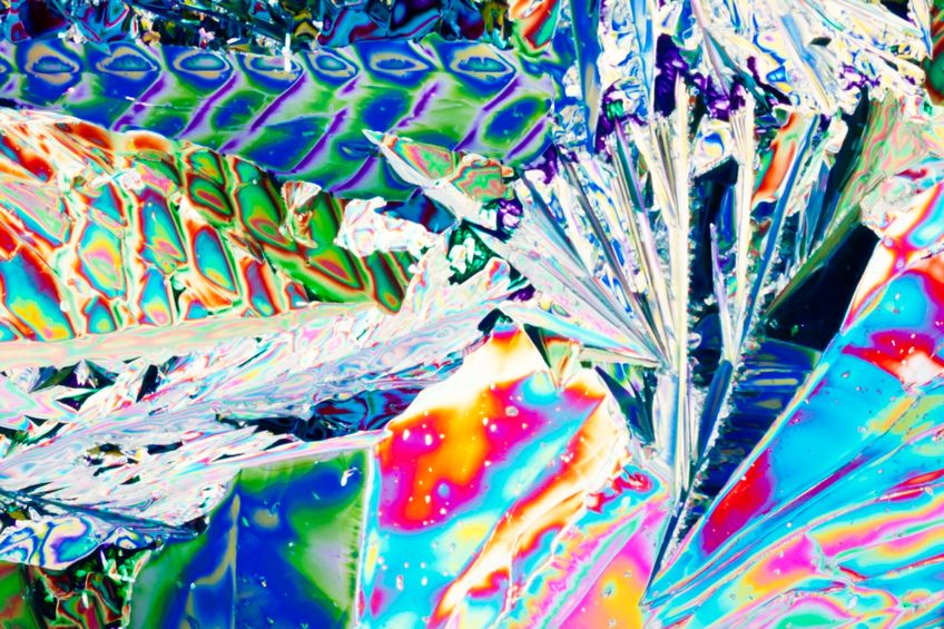 Crystals of tartaric acid form a colorful pattern under polarized light.